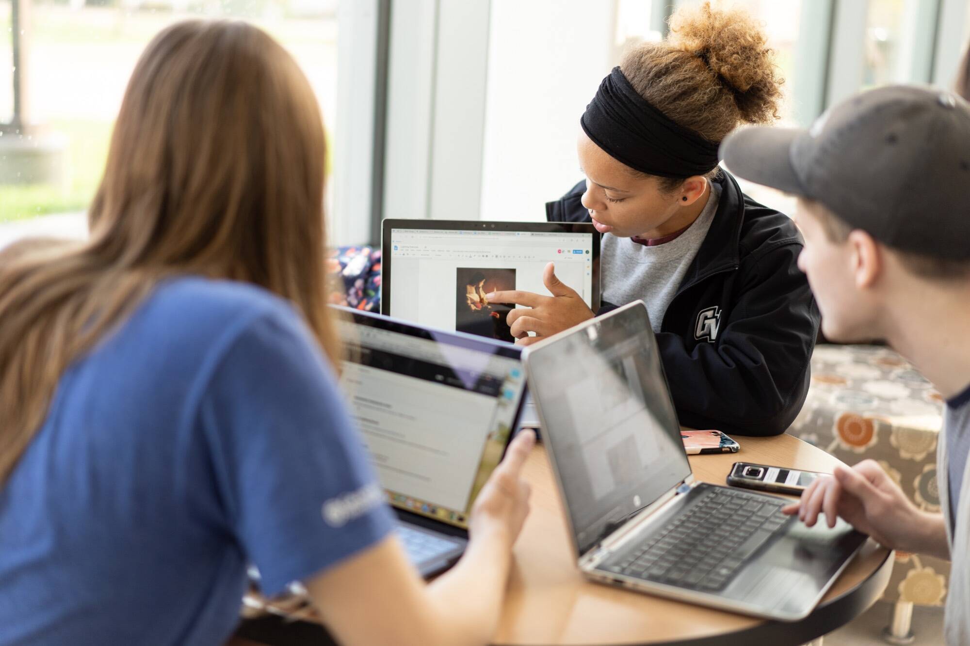 student working together on computers
